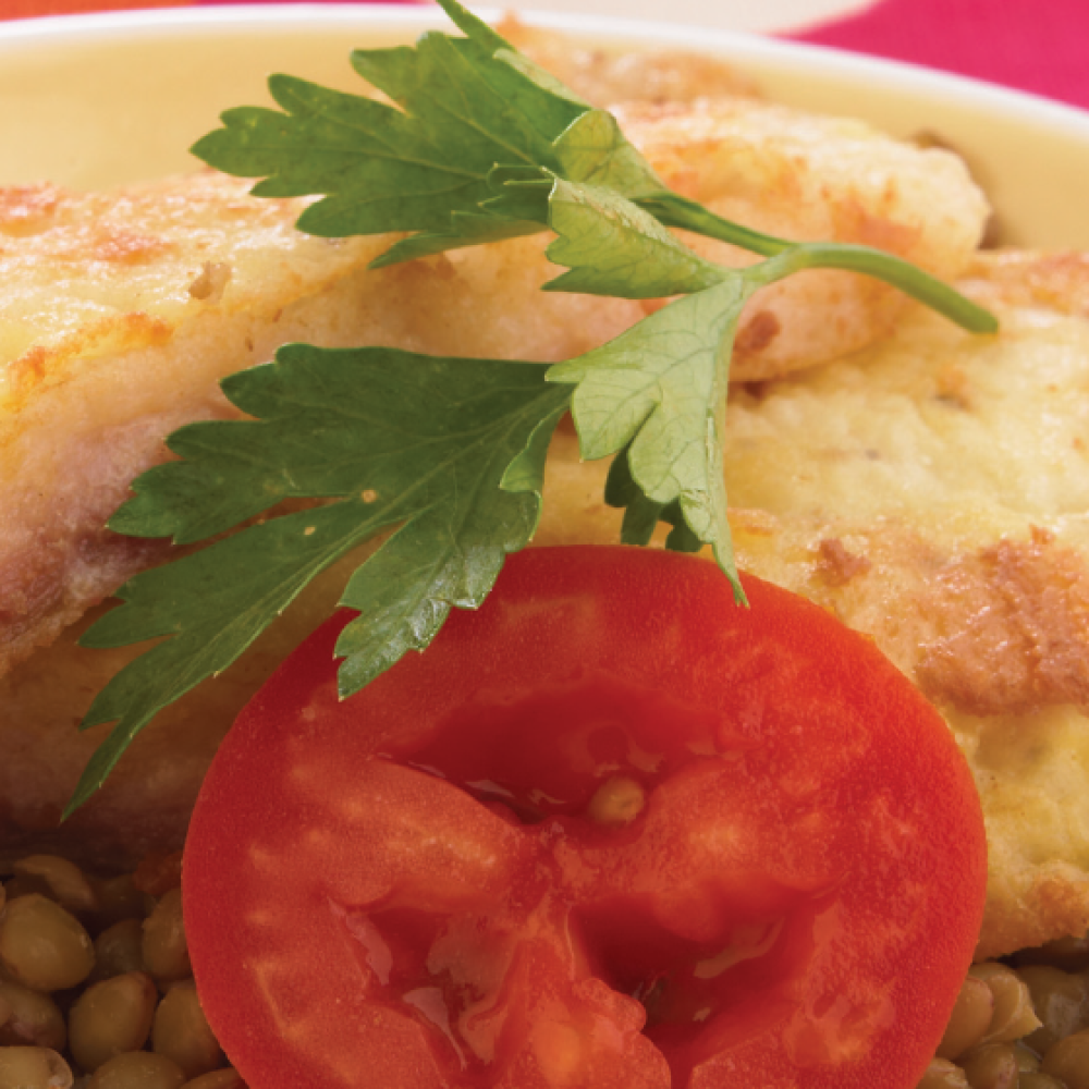 Filete de pescado sobre cama de lentejas