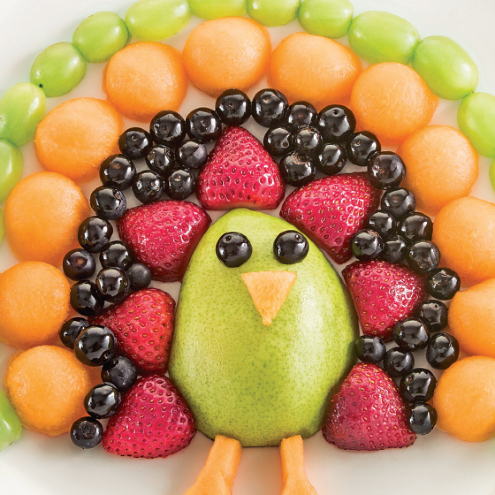 Postres para niños con frutas: pavo real de colores