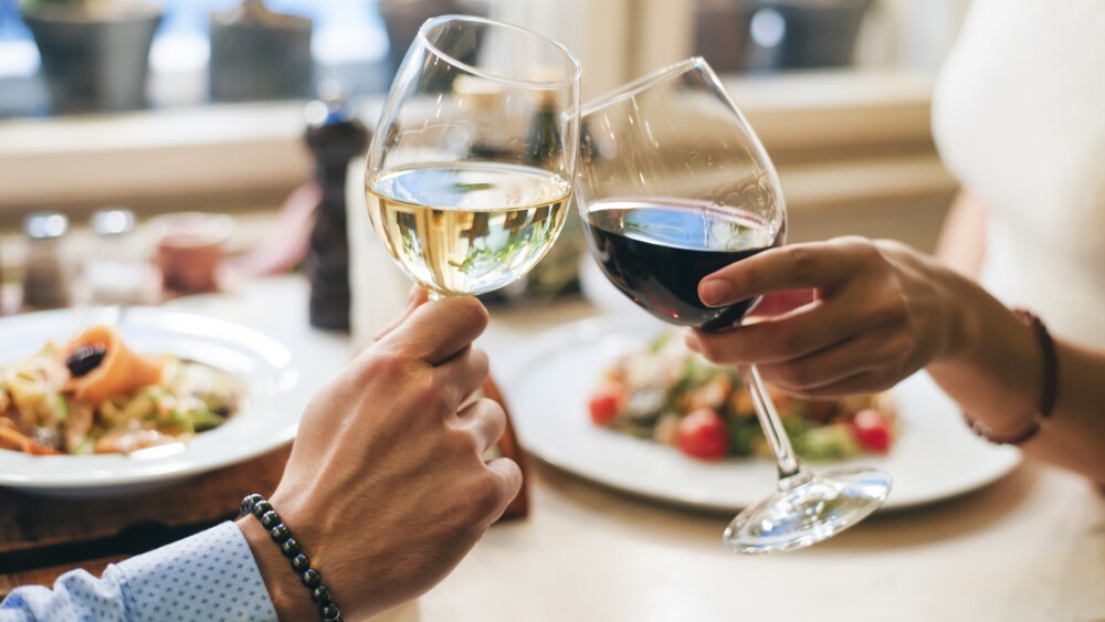 Couple toasting with wine, close-up