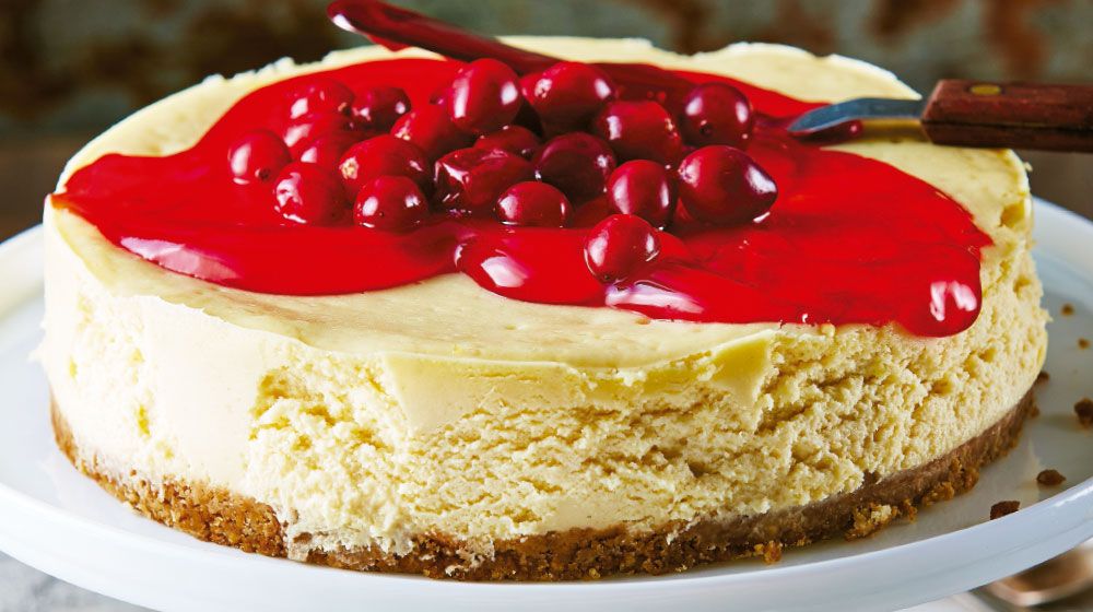 Pay de queso con mermelada de arándano fresco